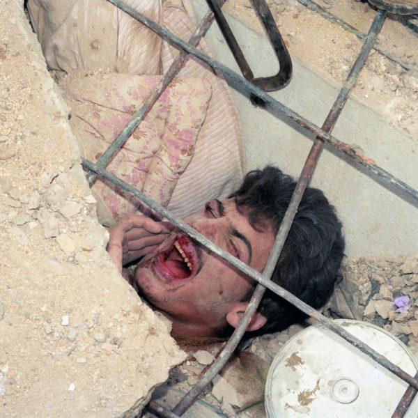 People rescue a man in Nabatieh South 1996